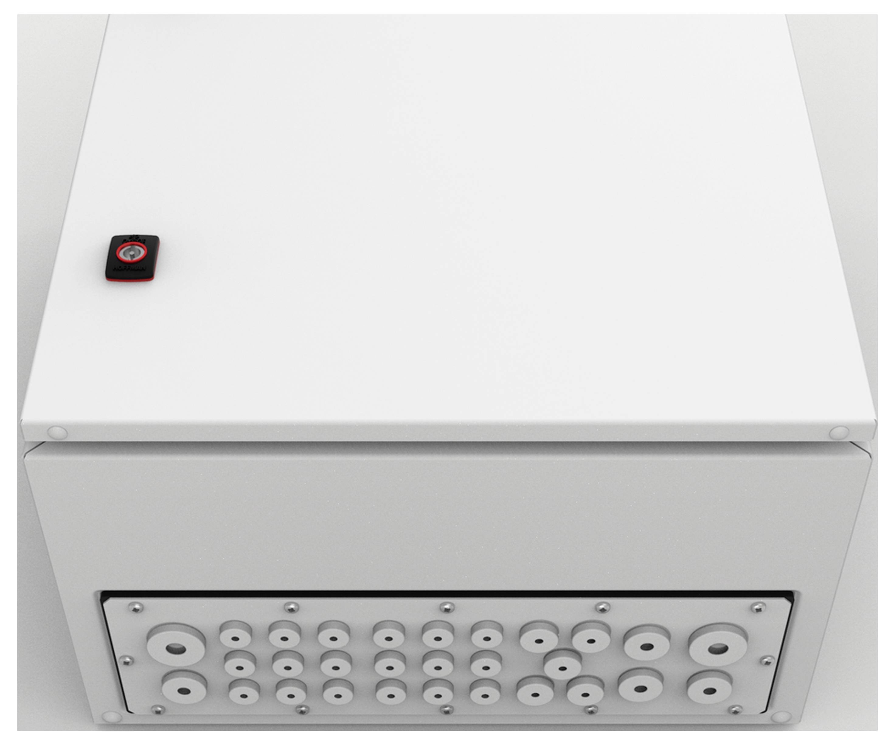 Weiße Box mit einem kleinen schwarzen Gegenstand darauf, zeigt mehrere kreisförmige Öffnungen an der Vorderseite.