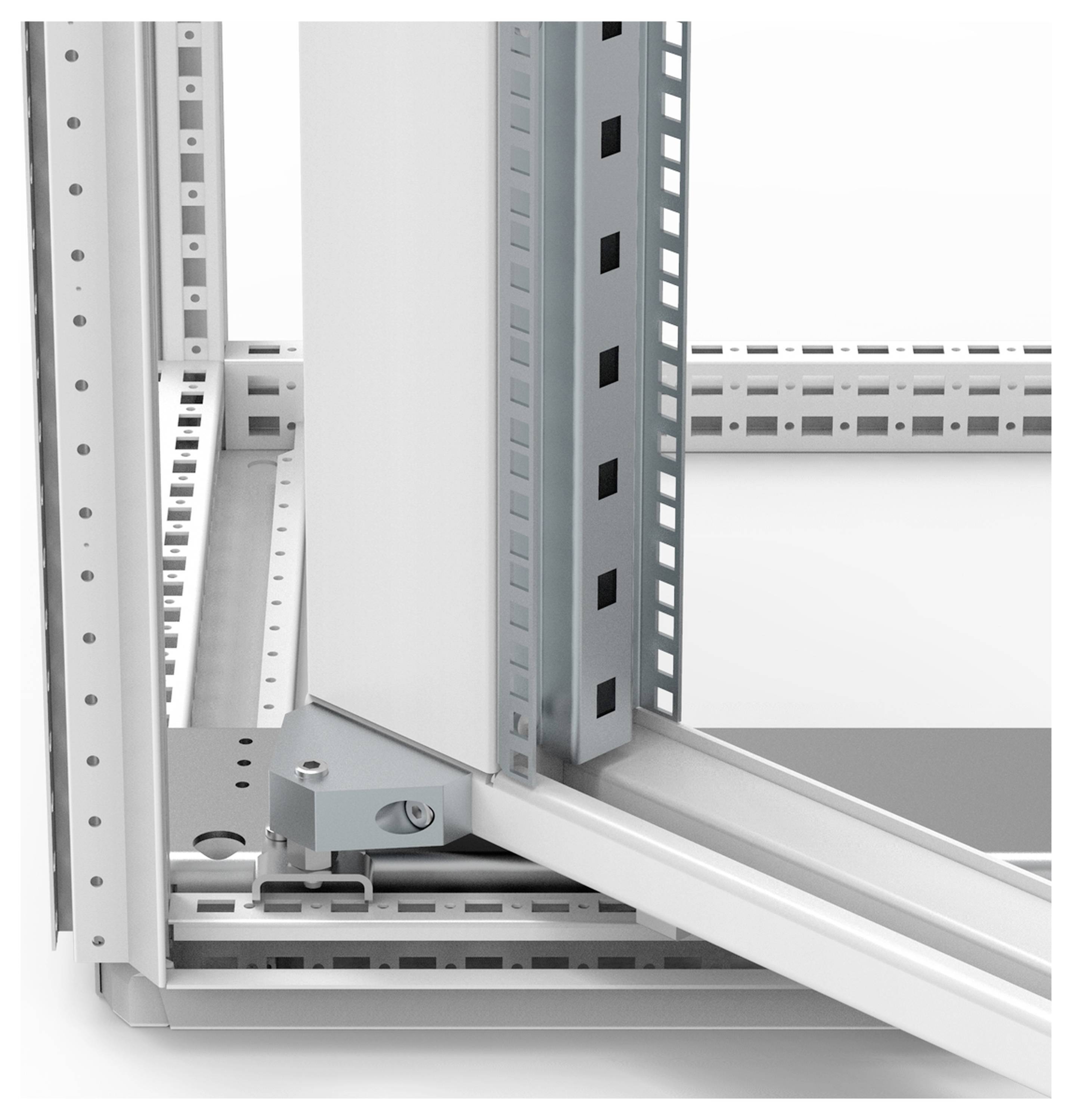 Der Ausschnitt zeigt ein graues Metallgerüst mit gestuften, gelochten Schienen und Verschraubungen, vermutlich Teil eines modularen Schranksystems.