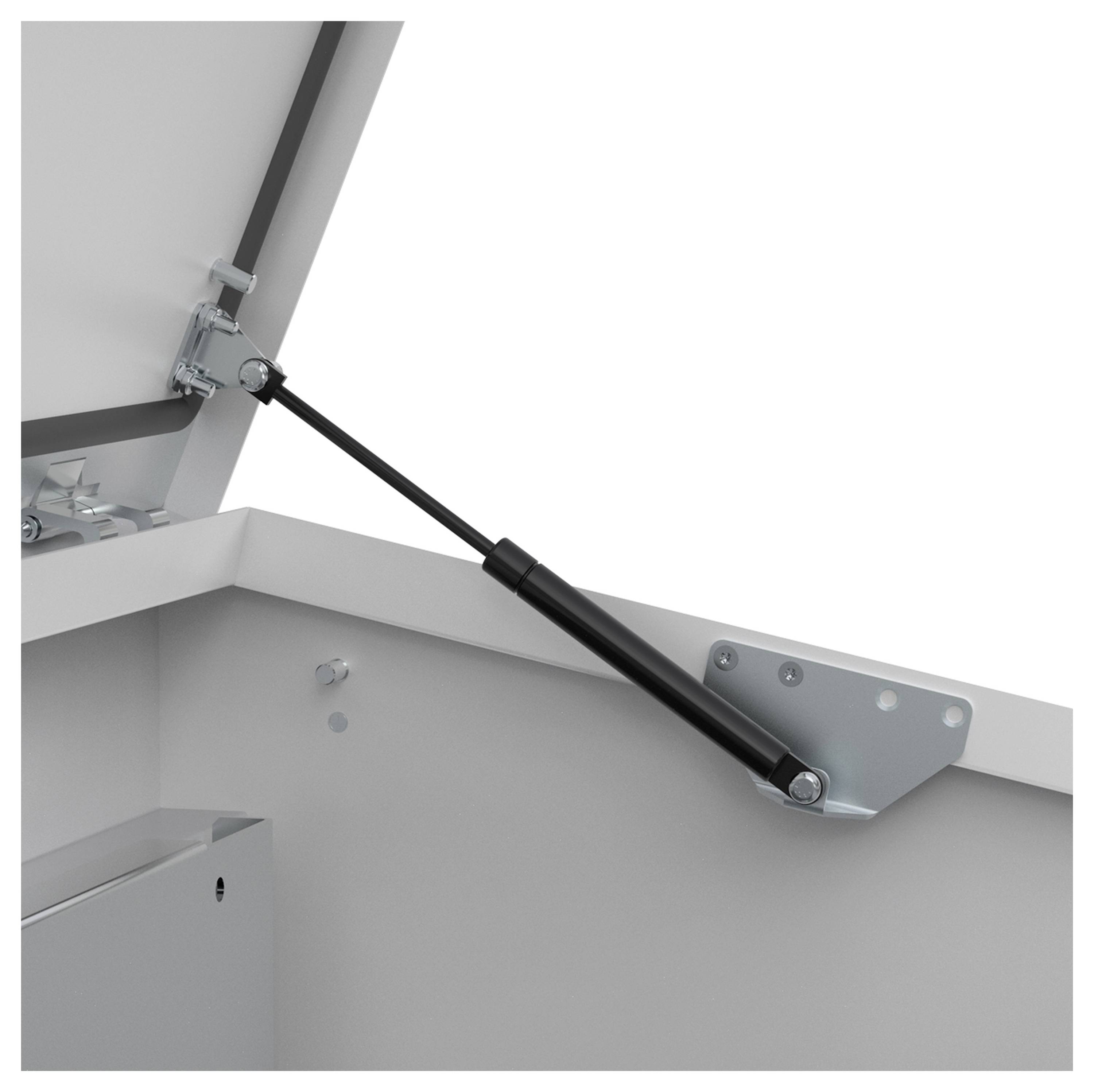 Ein Gasdruckdämpfer an einer geöffneten Metalltür, der die Tür in einer stabilen Position hält.