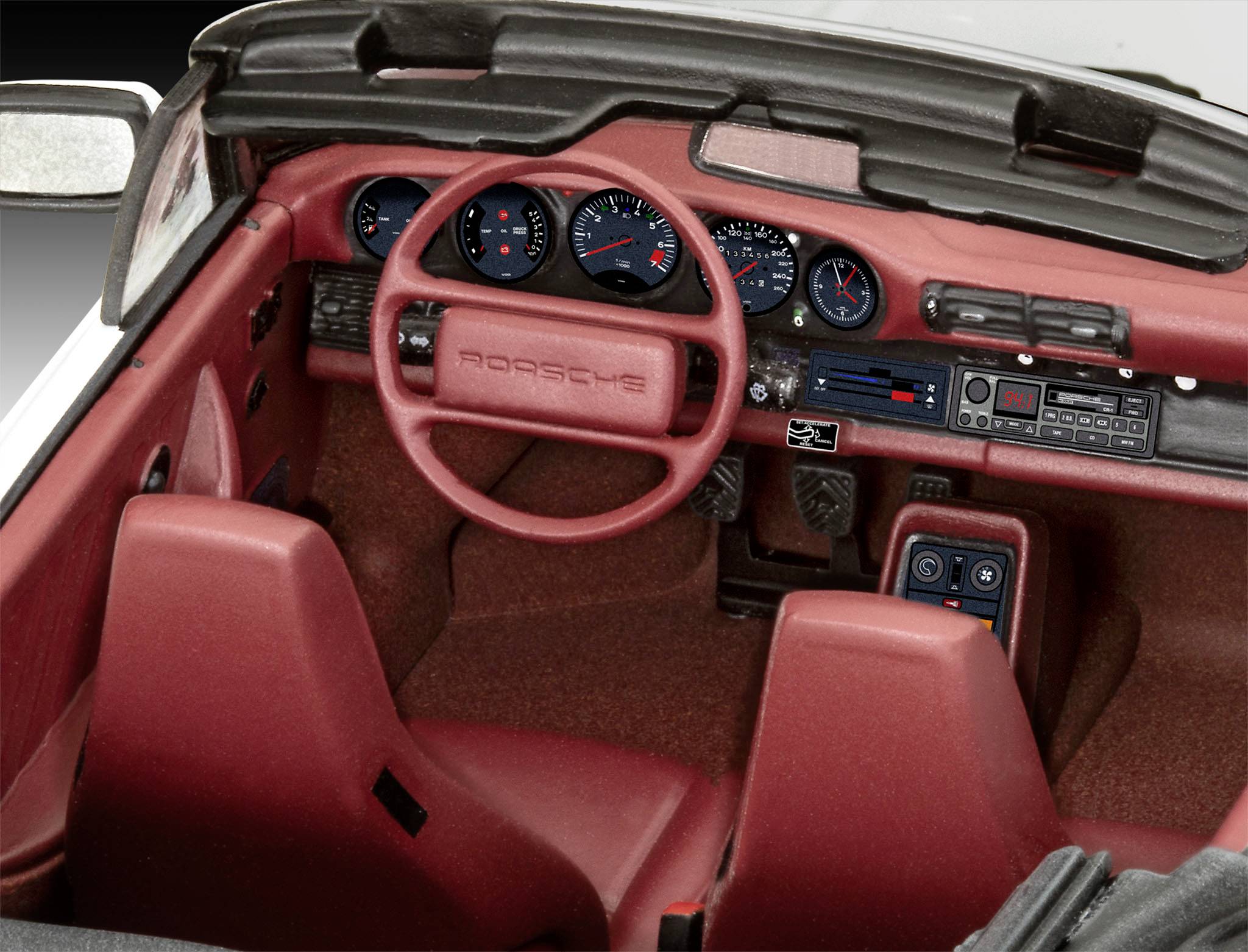 Innenraum eines roten Cabrio-Sportwagens mit Lenkrad, Armaturenbrett und Schalthebel; stilisierte Darstellung des Cockpits.