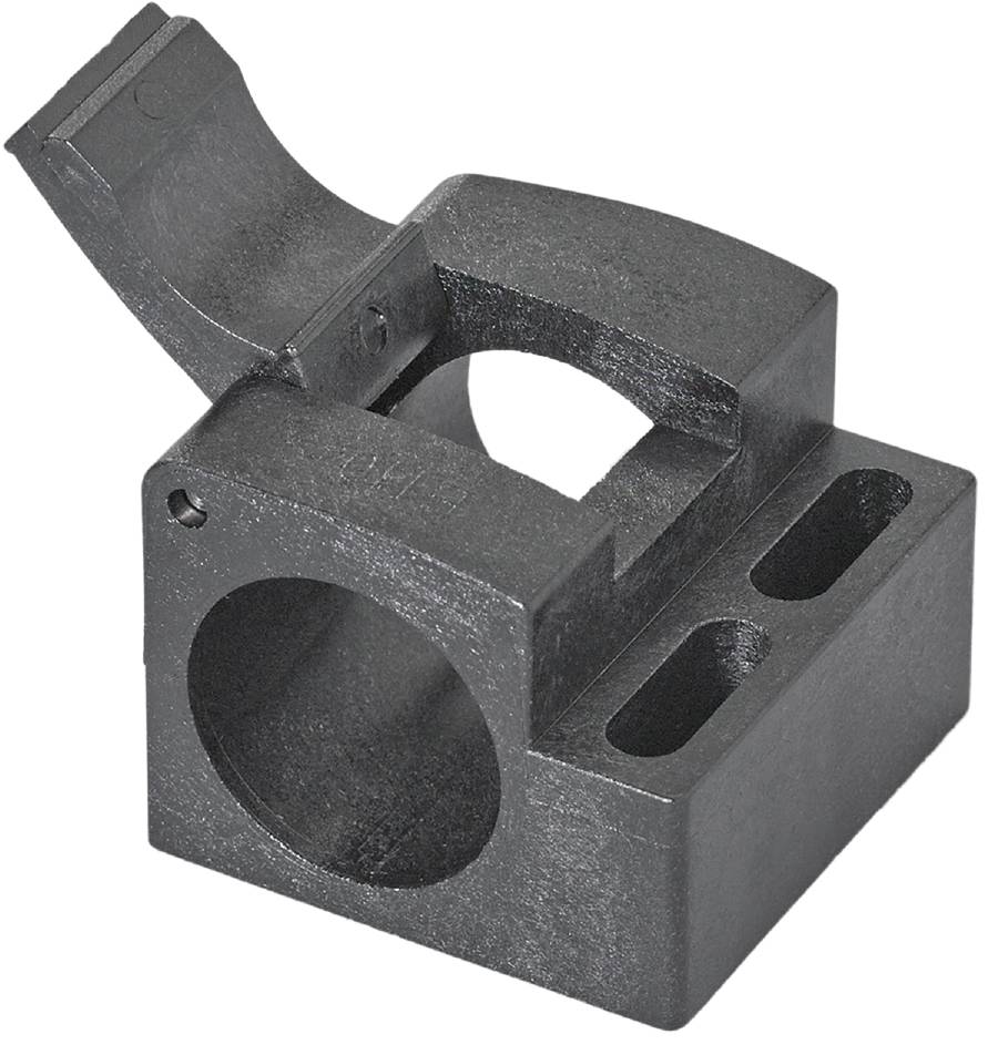 Metallblock mit kreisförmiger und rechteckiger Öffnung; scheinbar ein technisches Bauteil, vermutlich für eine mechanische Anwendung.