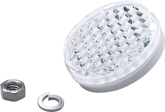 Rundes Plastikobjekt mit diamantartiger Oberfläche, daneben ein kleiner Metallring. Vermutlich ein Lichtreflektor oder dekoratives Element.