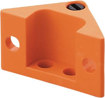 Ein orangefarbenes rechtwinkliges Plastikstück mit drei Löchern und einer schwarzen Schraube an der Oberseite.