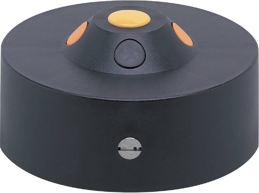 Ein schwarzer runder Sensor mit gelben und schwarzen Markierungen, wahrscheinlich Teil eines technischen oder elektronischen Geräts.