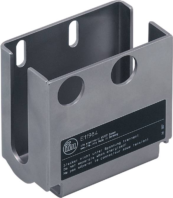 Ein metallisches Bauteil mit zwei Löchern und einem Aufkleber, auf dem Sicherheitswarnungen in mehreren Sprachen zu sehen sind.
