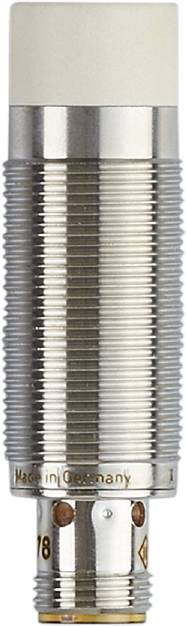 Eine Nahaufnahme eines Schraubengewindes, wobei die feinen, spiralförmigen Kanten und das metallische Material im Detail zu sehen sind.