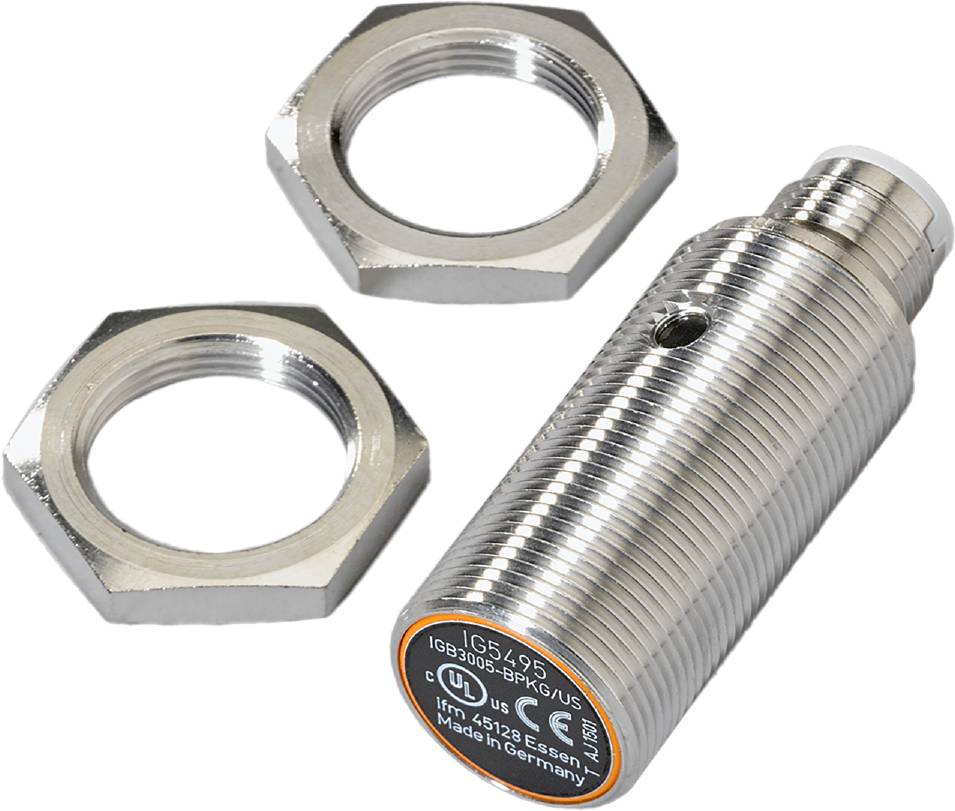 Ein zylindrischer, metallischer Sensor neben zwei sechseckigen Muttern. Der Sensor ist mit technischen Details und 'Made in Germany' beschriftet.