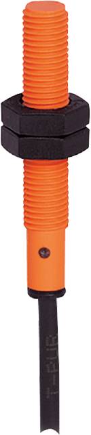 Ein orangefarbenes gerilltes Objekt, möglicherweise ein Griff oder eine Komponente eines Werkzeugs mit einem kleinen schwarzen Punkt unten.