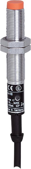 Silbernes zylindrisches Metallteil mit CE-Markierung und einem GL-Logo auf schwarzem Grund, Teil eines technischen Geräts.