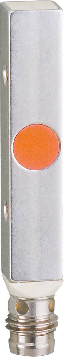 Ein orangefarbener Knopf auf einer metallischen Oberfläche.