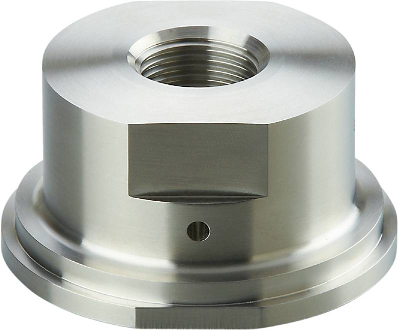 Eine präzise gefertigte, silberne Metallkonstruktion mit einem zentralen Gewinde und umliegenden glatten, abgerundeten Kanten.