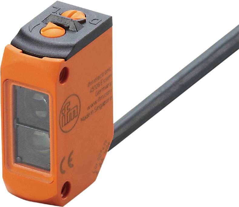 Ein rechteckiger Sensor mit Kabelanschluss, orangefarbenem Gehäuse und zwei runden Bedienelementen auf der Oberseite, wird dargestellt.