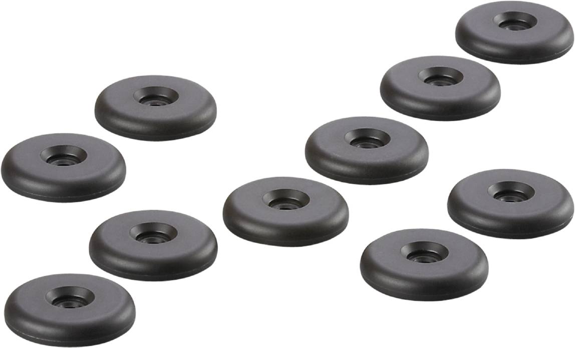 Schwarze Gummifüße, wie Dämpfer oder Anti-Rutsch-Pads, auf einer weißen Oberfläche verteilt.