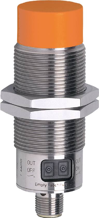 Zylinderförmiger Metall-Gegenstand mit gerillter Oberfläche und sechseckigen Muttern; wahrscheinlich ein Maschinenteil oder Sensor.