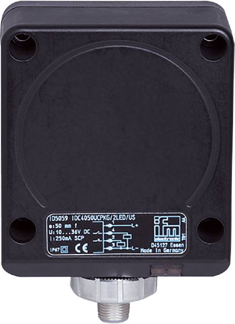 Schwarzes, quadratisches elektronisches Gerät mit Beschriftungen und Schaltbild auf der unteren Hälfte; vier Schrauben sichtbar.