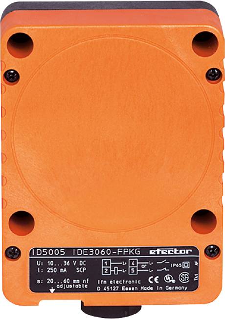 Ein orangefarbener Sensor mit schwarzer Beschriftung, darunter technische Spezifikationen: 'U: 10...36 V DC, Id: 250 mA, ector'.