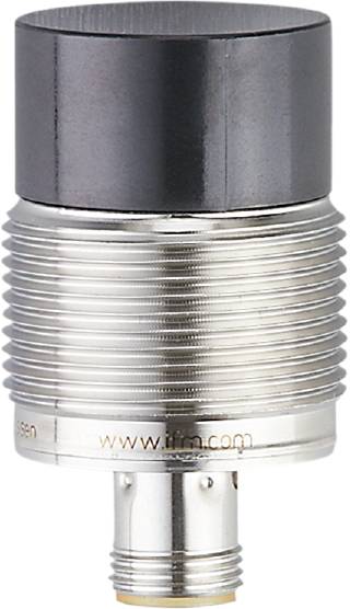 Ein zylindrischer Metallzylinder mit der Aufschrift 'www.ifm.com' ist zu sehen. Oben ist er schwarz, unten silberfarben gerippt.