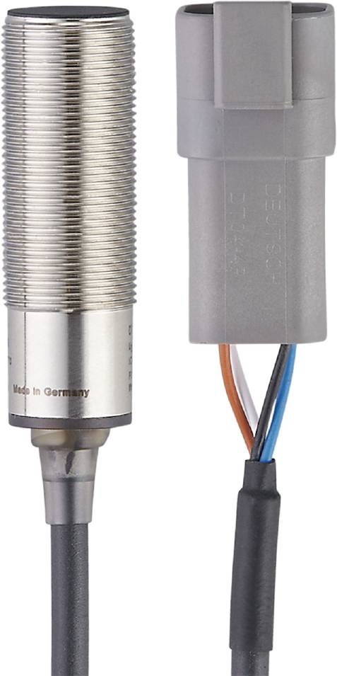 'Seitenansicht eines metallischen Sensors mit Kabelanschlüssen, Aufschrift 