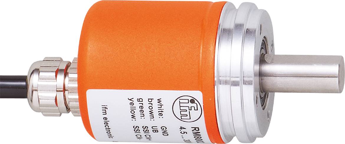 Eine orangefarbene Komponente mit einem Etikett, das Kabelanschlüsse in den Farben Weiß, Braun, Grün und Gelb beschreibt.