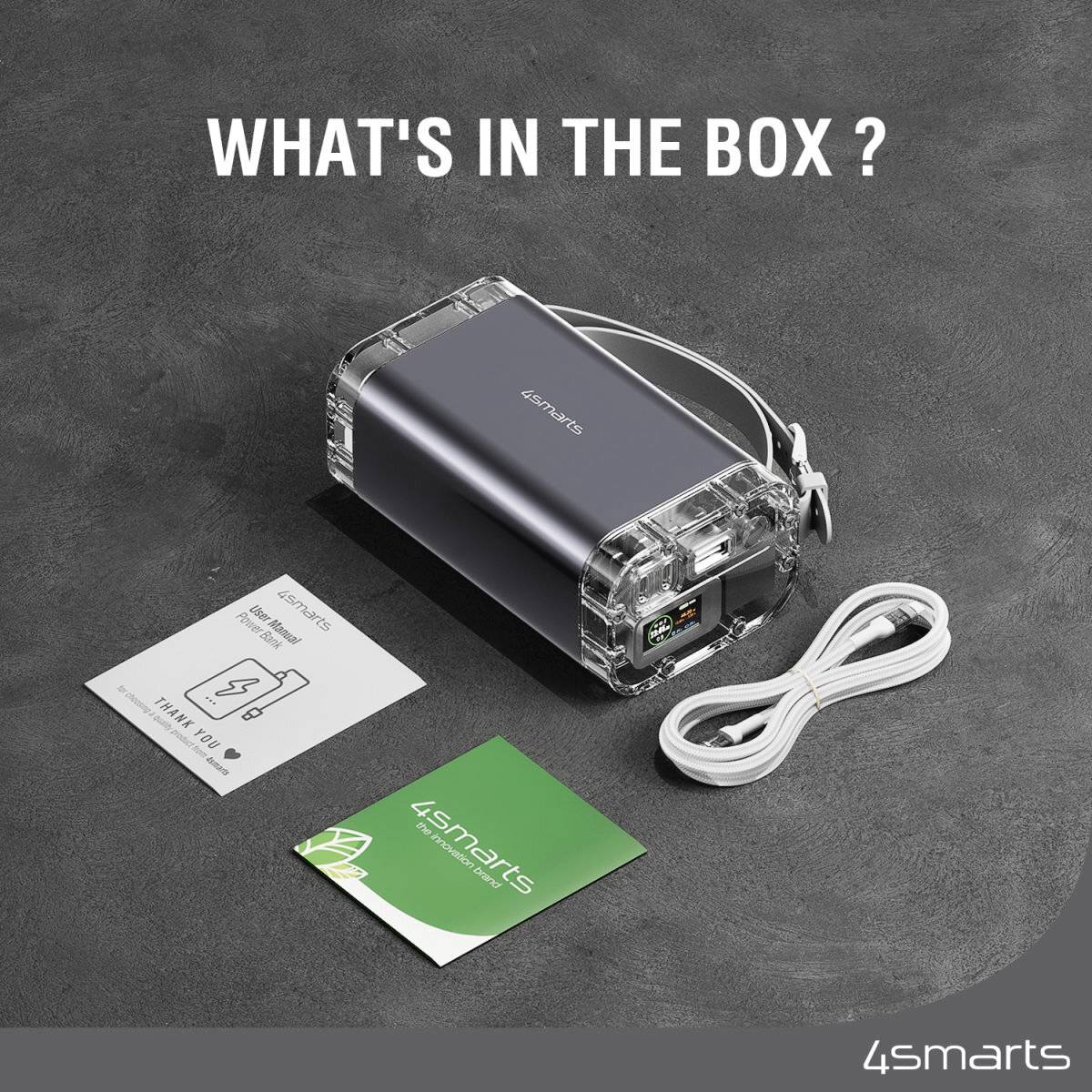 '4smarts' Powerbank mit transparentem Gehäuse, beigelegtem Kabel, 'Warranty' und 'Welcome' Karten. Textbild: 'WHAT'S IN THE BOX?'