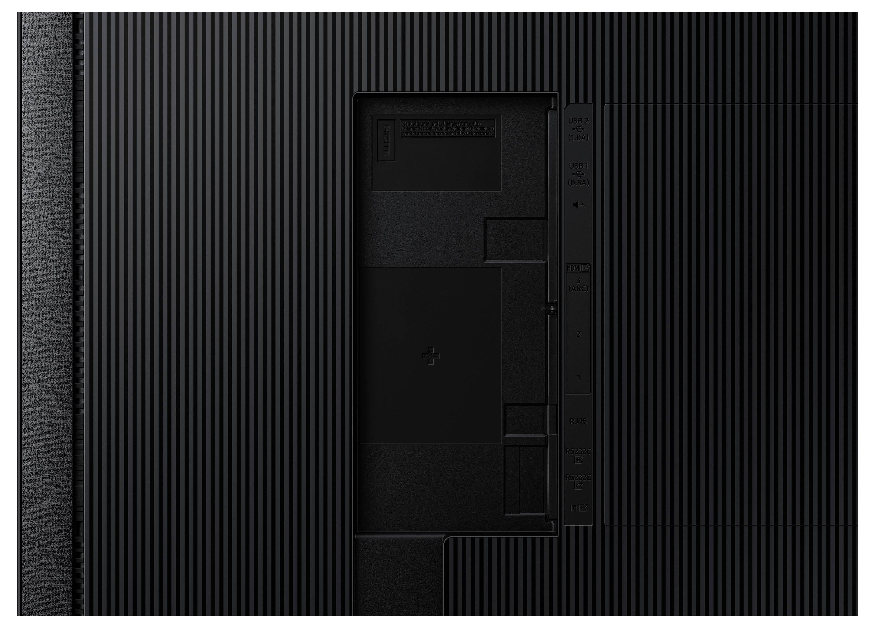 Rückseite eines Fernsehers mit geripptem Design, zeigt Eingangs- und Ausgangsanschlüsse für Strom, HDMI und USB auf einer schwarzen Oberfläche.