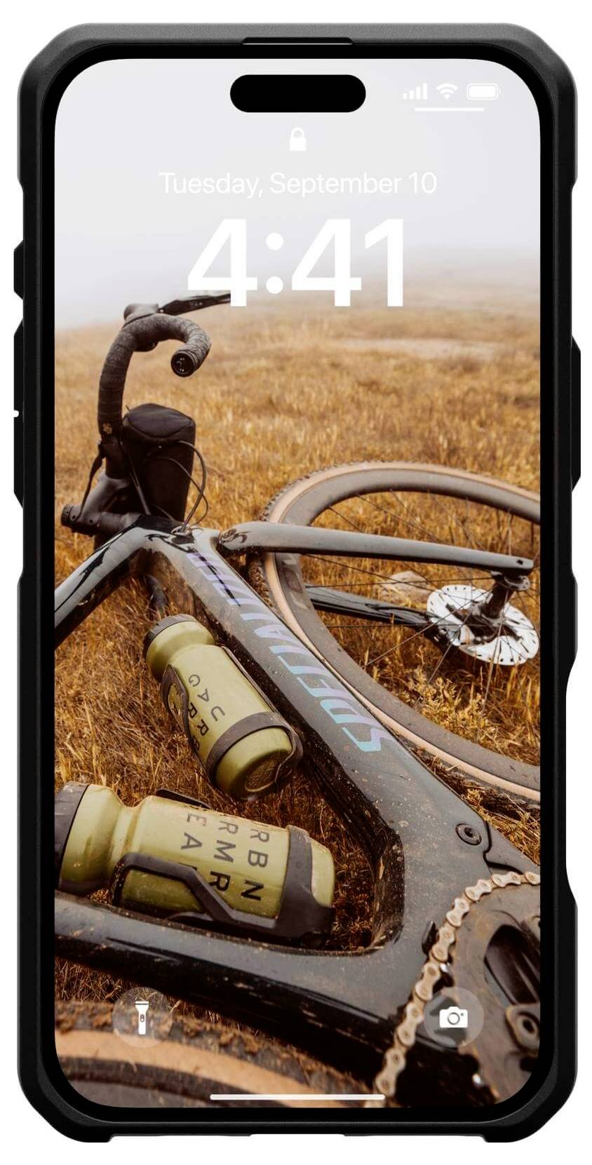 Ein schwarzes Smartphone zeigt einen Hintergrund mit einem Fahrrad auf einem grasbewachsenen Feld. Das Datum auf dem Bildschirm ist Dienstag, 10. September.