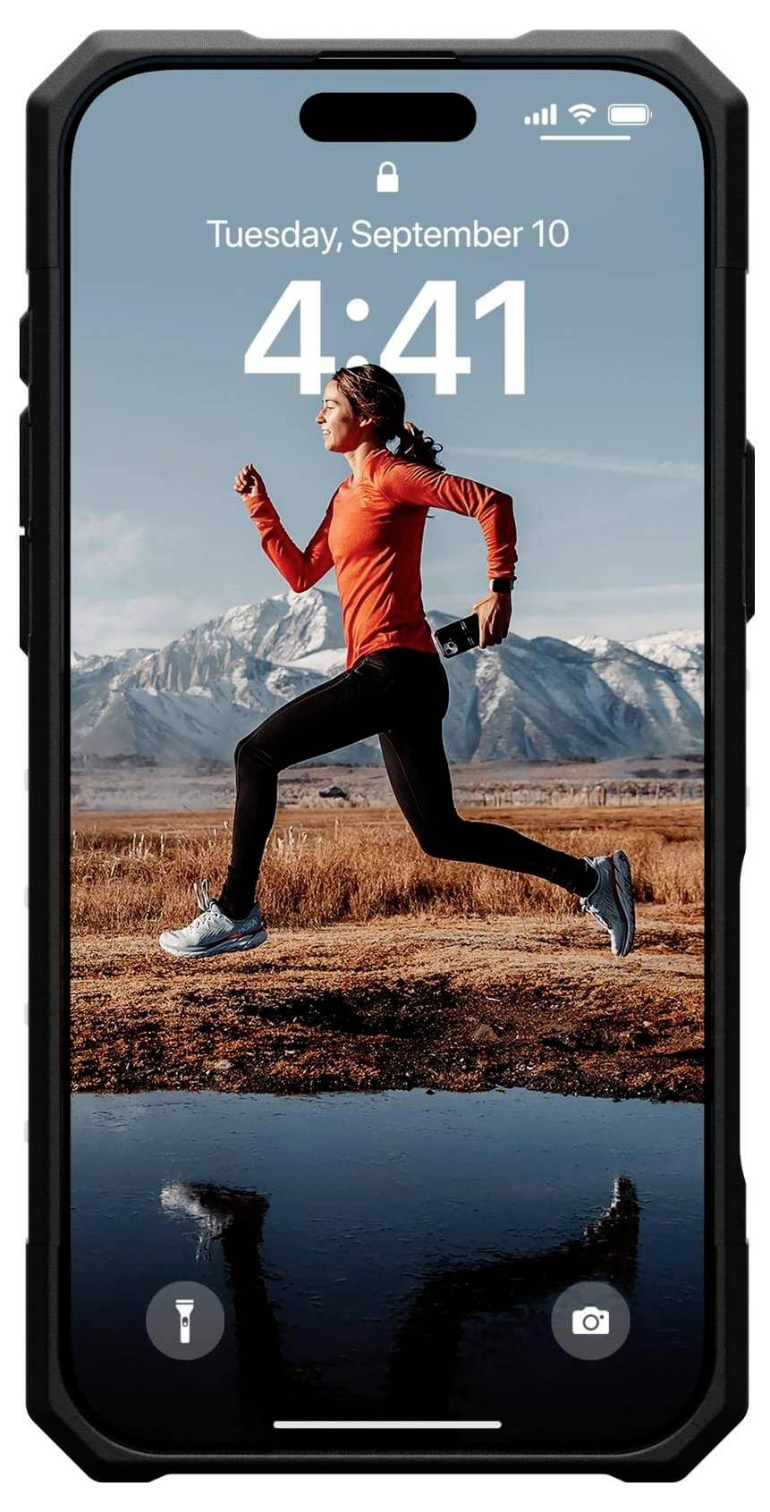 Smartphone-Bildschirm zeigt: Läuferin in rotem Pullover vor Bergkulisse, Uhrzeit 4:41, Datum 'Tuesday, September 10', Symbole für Telefon und Kamera.