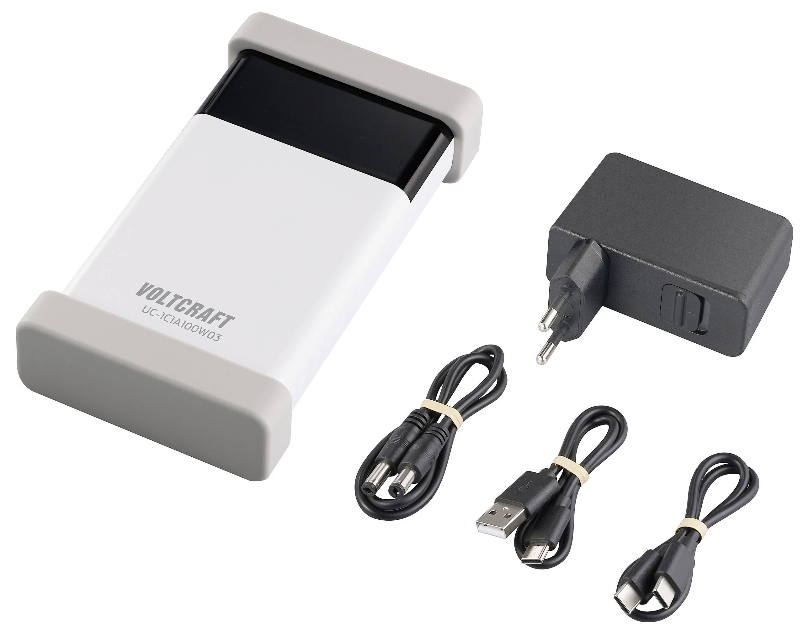 Ein weiß-schwarzes Ladegerät von Voltcraft mit zwei USB-Kabeln und einem Netzstecker. Ideal zum Aufladen verschiedener Geräte.