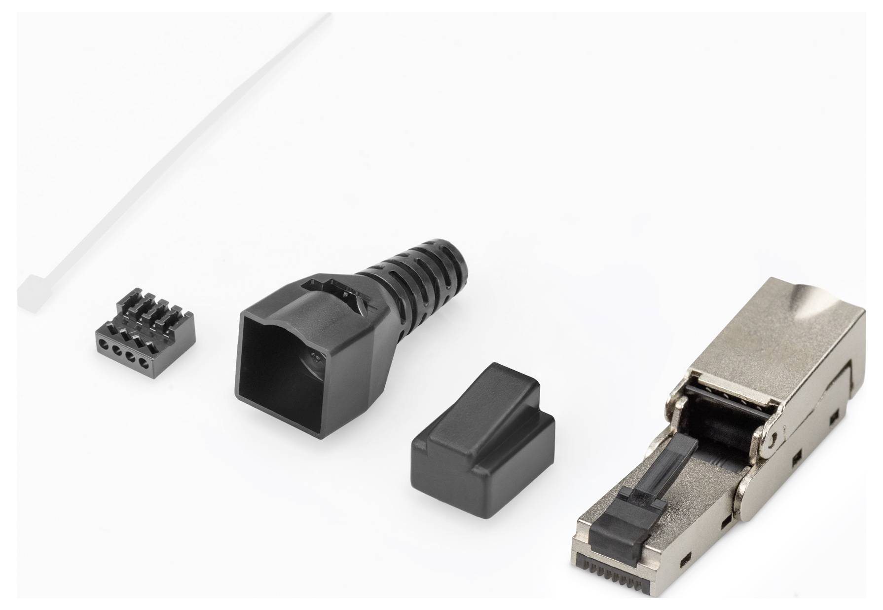 Ein zerlegbarer RJ45-Stecker in Einzelteilen: geschirmtes Modul, Kabeltülle, Abdeckkappe und Kontaktblock links.