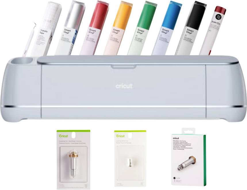 Ein Schneideplotter mit Cricut-Logo, umgeben von verschiedenen Vinylrollen in mehreren Farben. Zubehörteile liegen darunter.