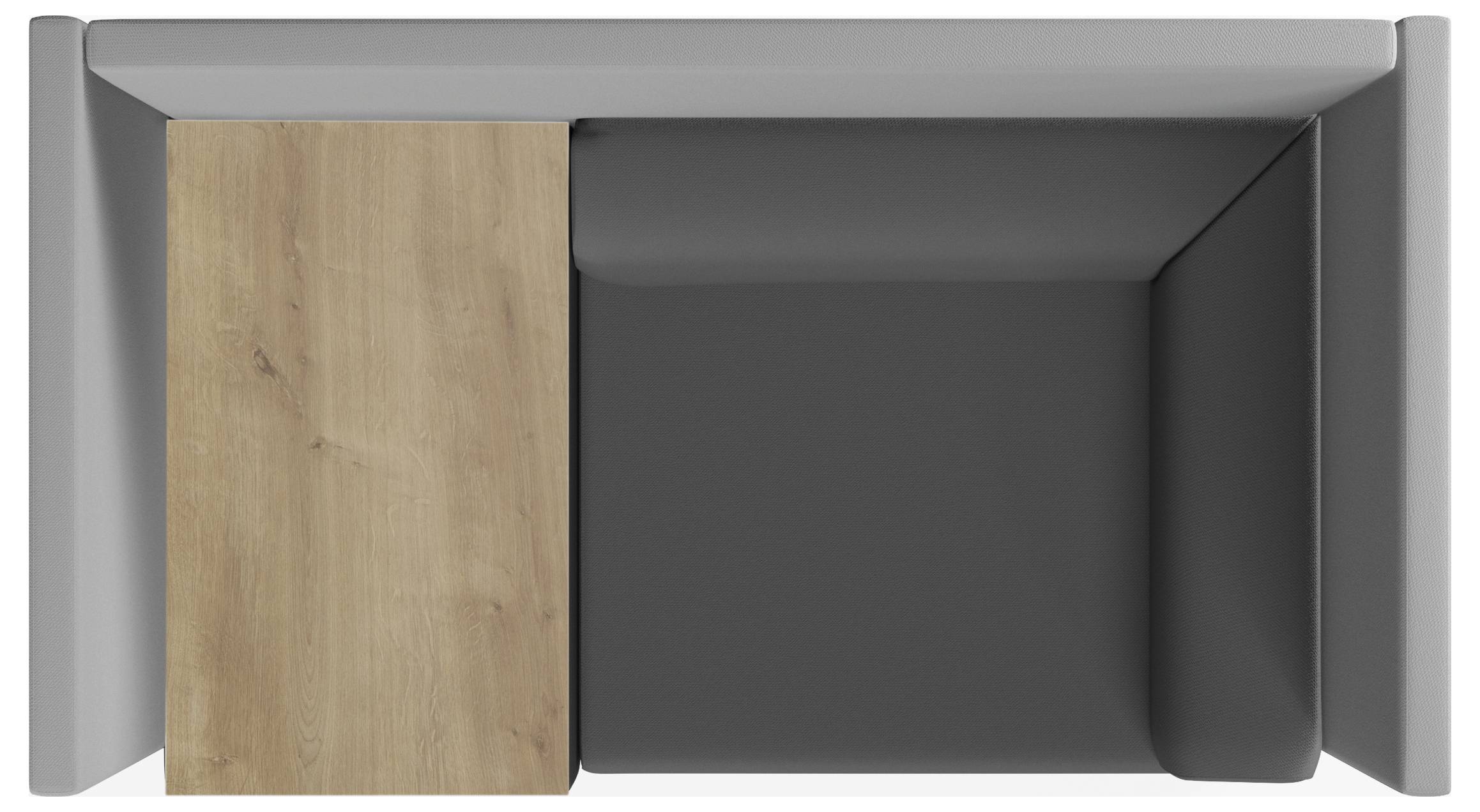 Graue Loungesitzgruppe mit einem integrierten Holztisch, Ansicht von oben. Perfekt für moderne Büroumgebungen.
