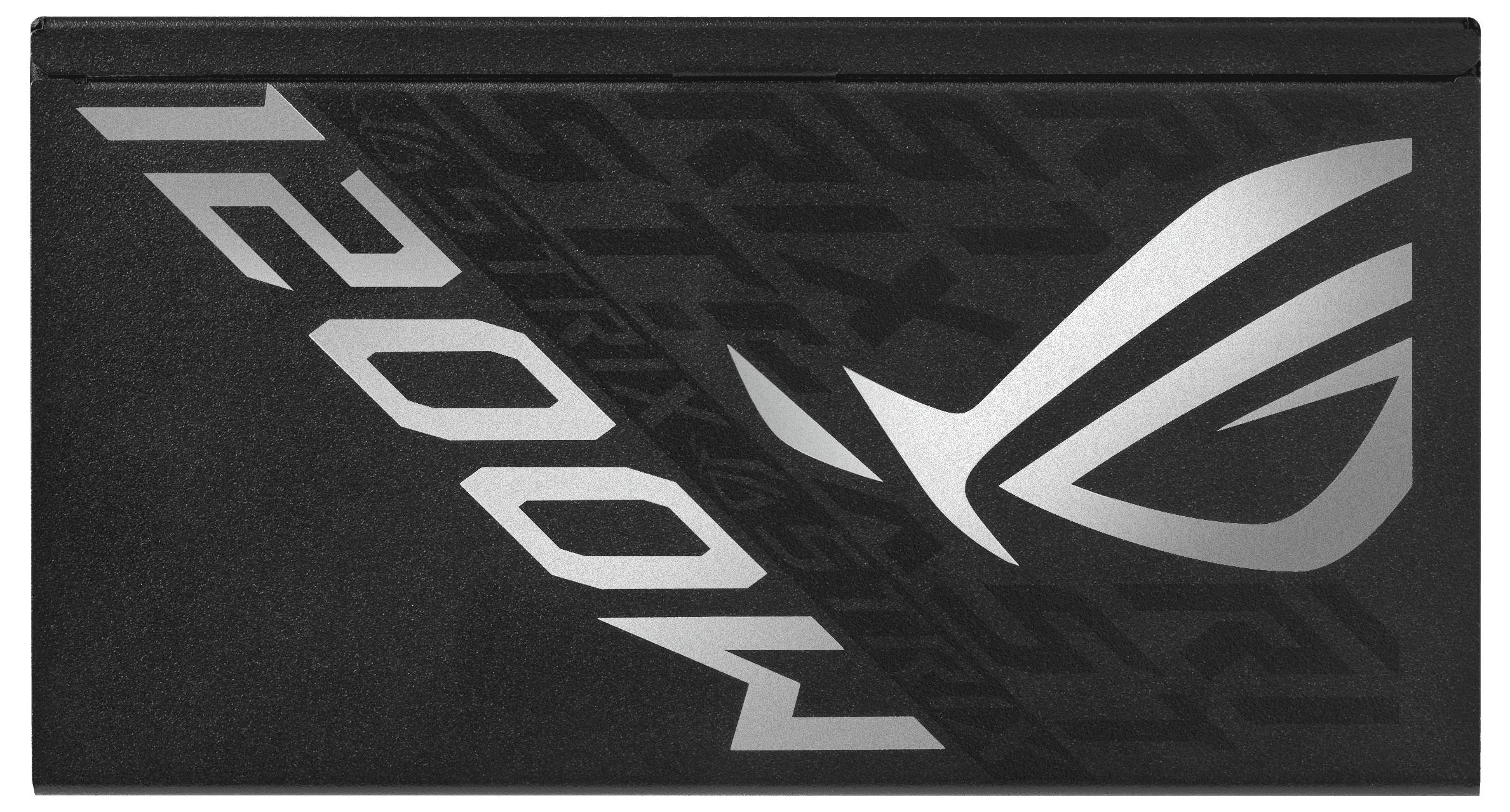 Schwarzes rechteckiges Gerät mit silbernem Symbol und der Aufschrift 'ROG 1200W', vermutlich ein technisches Gerät oder Netzteil.