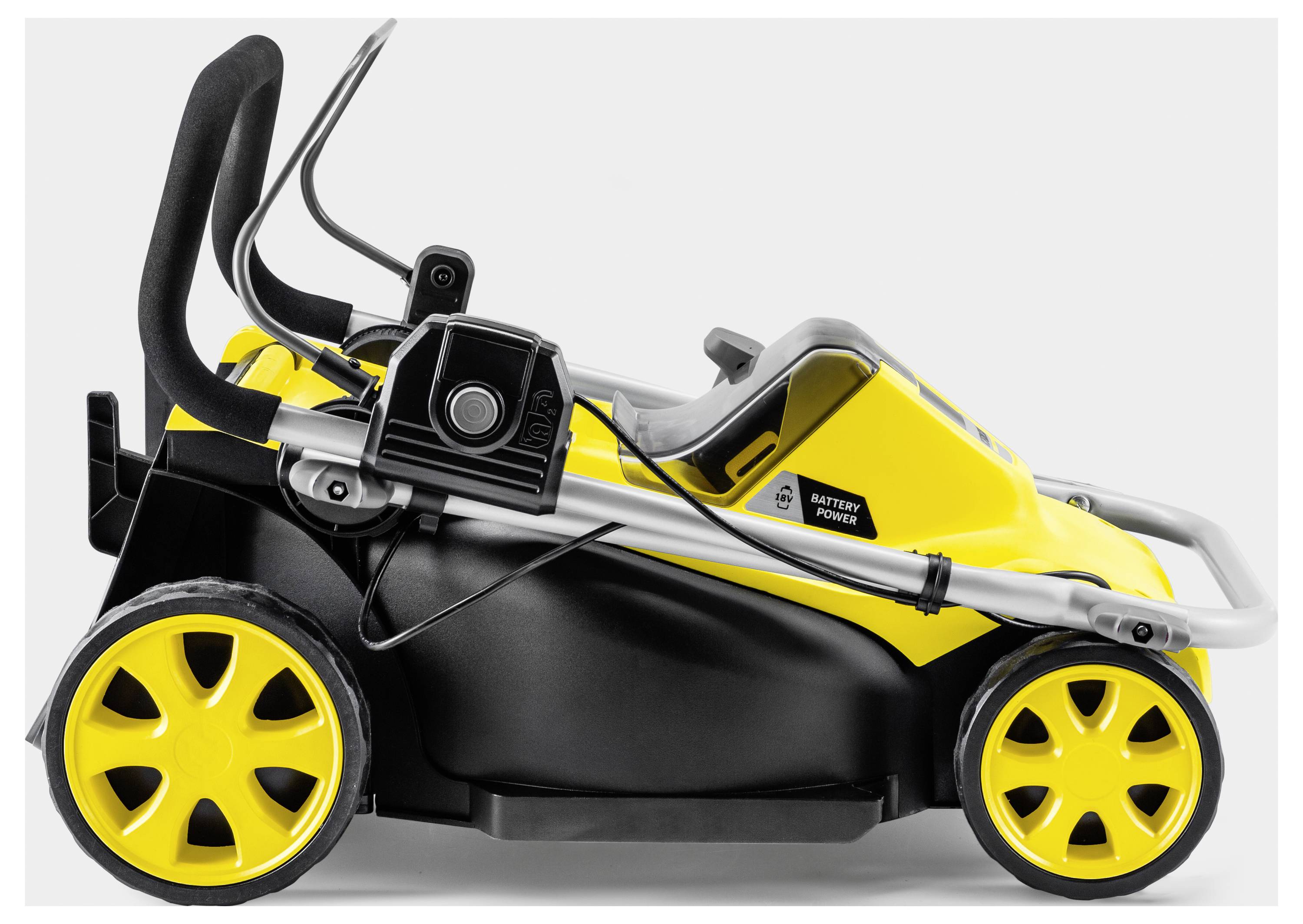 Gelber elektrischer Kinderauto-Motor mit schwarz-gelbem Gehäuse, großen gelben Rädern und Sicherheitsgriffen, seitliche Ansicht.