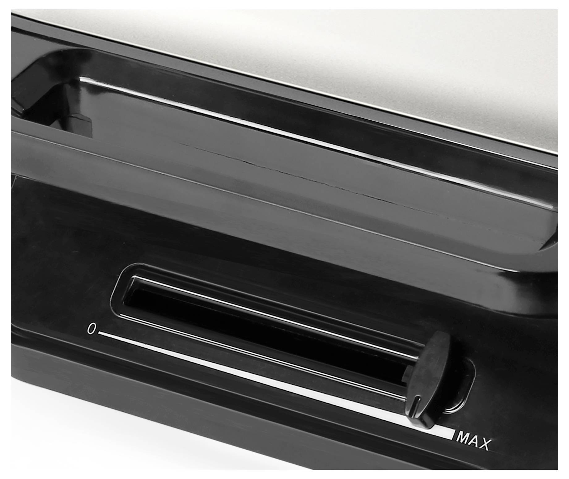 Geschlossener schwarzer Schieberegler auf einem Gerät, markiert von '0' bis 'MAX'.