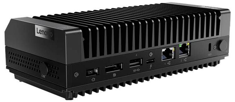 Ein schwarzer, rechteckiger Mini-PC mit Lüftungsschlitzen auf der Oberseite. Vorne sind mehrere Anschlüsse sichtbar.