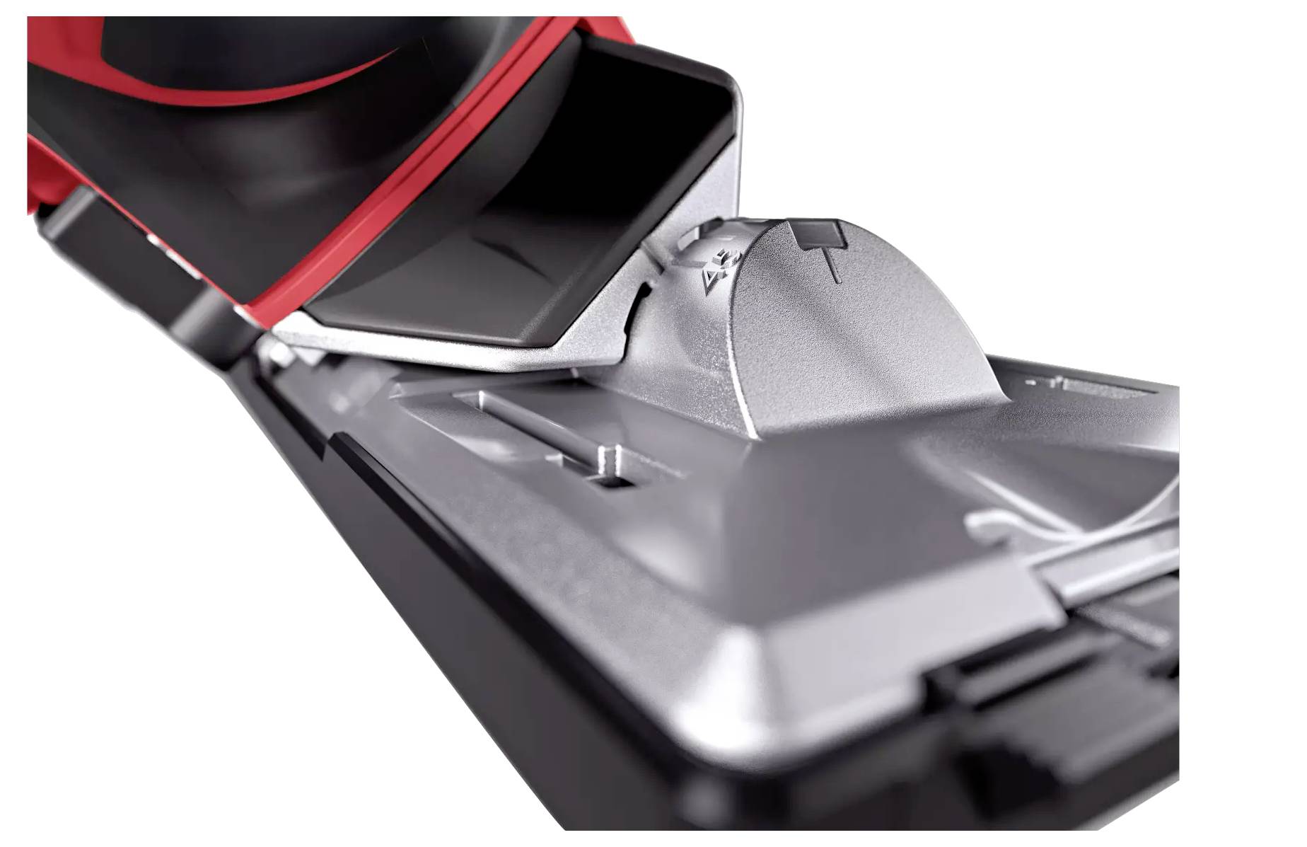 Nahaufnahme eines Staubsaugerkopfes mit Bürste und Metallabdeckung. Fokus auf Technologie und Funktionalität des Geräts.