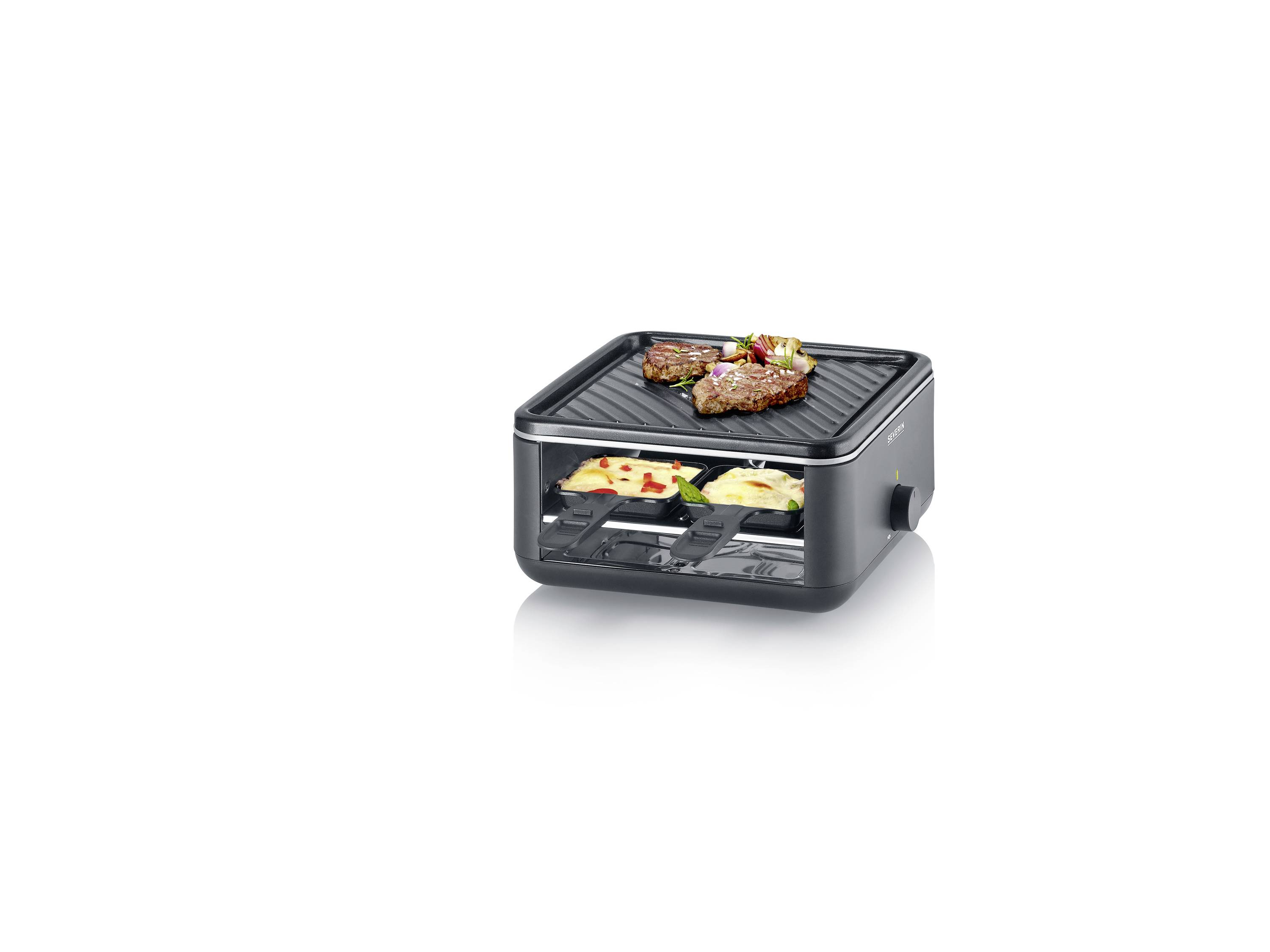 Ein elektrischer Tischgrill mit Fleisch und Gemüse oben und geschmolzenem Käse in Schälchen darunter, ideal für Raclette.
