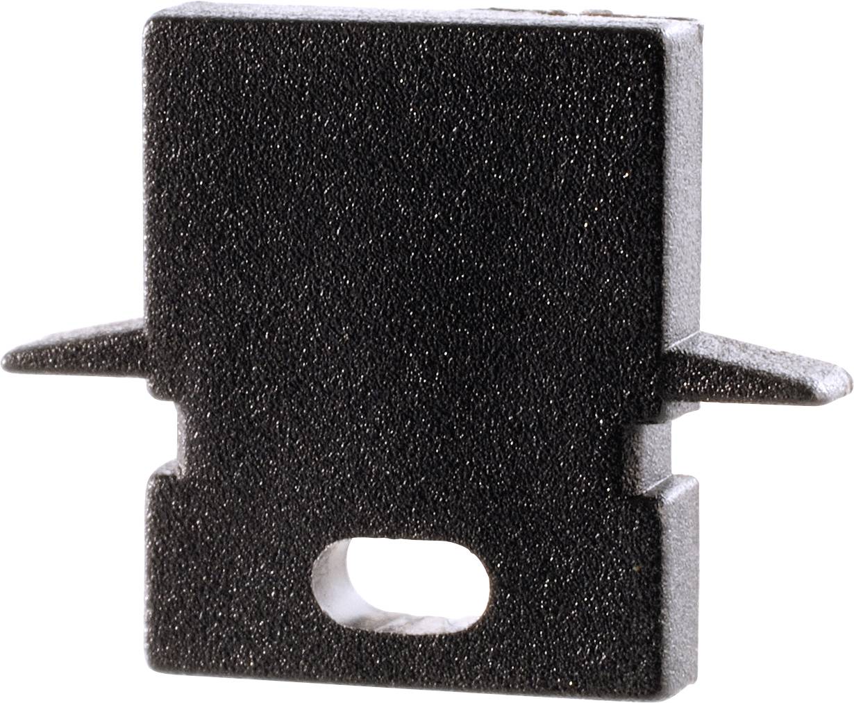 Schwarzes, rechteckiges Plastikteil mit Loch in der Mitte und zwei seitlichen Haltern. Verwendung unklar, möglicherweise ein Verbindungselement.