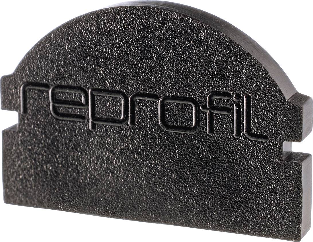 Schwarzes, halbkreisförmiges Kunststoffteil mit eingraviertem Schriftzug 'reprofil'.