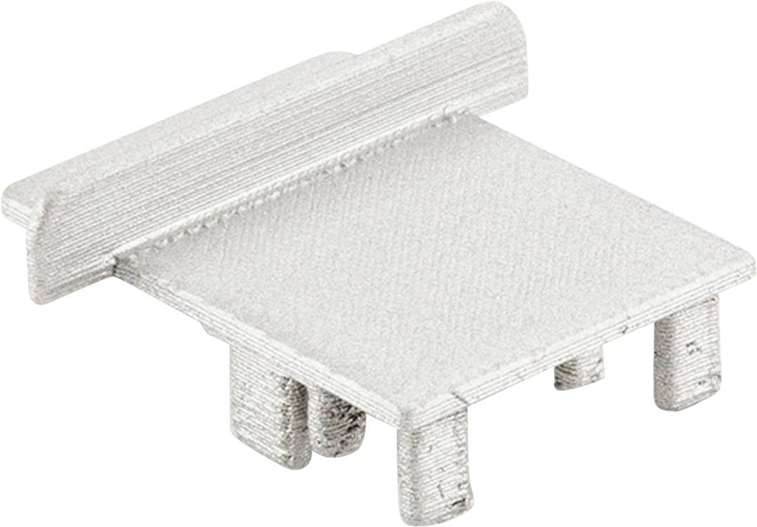 Ein rechteckiger, silberner Metallverbinder mit mehreren kurzen Stiften unten, die aus der Grundplatte herausragen.