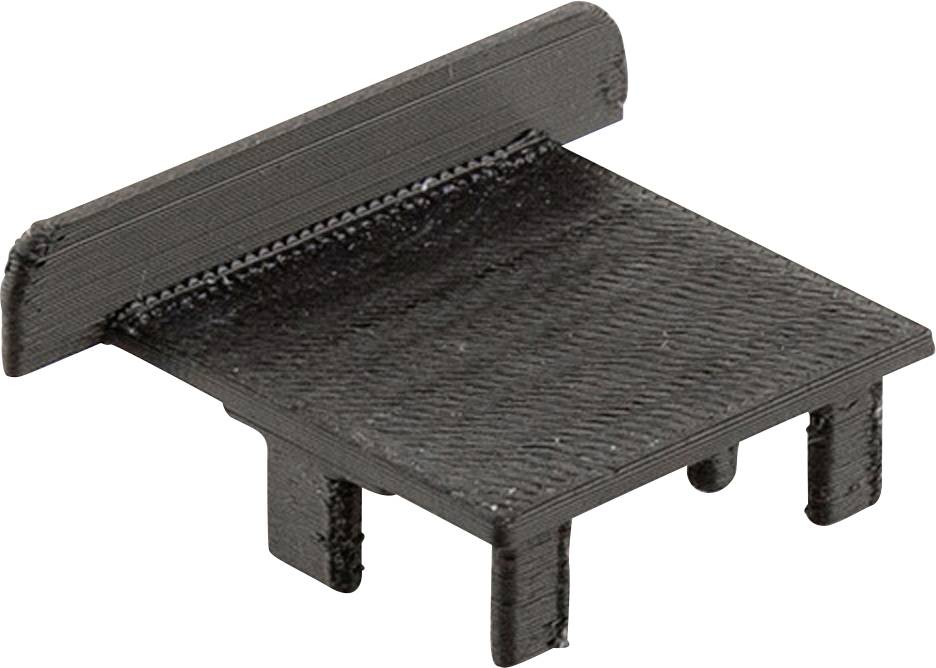 Schwarzes Kunststoffersatzteil mit rechteckiger Form und vier kurzen Stiften an der Unterseite, möglicherweise ein Verschluss oder Abdeckung.