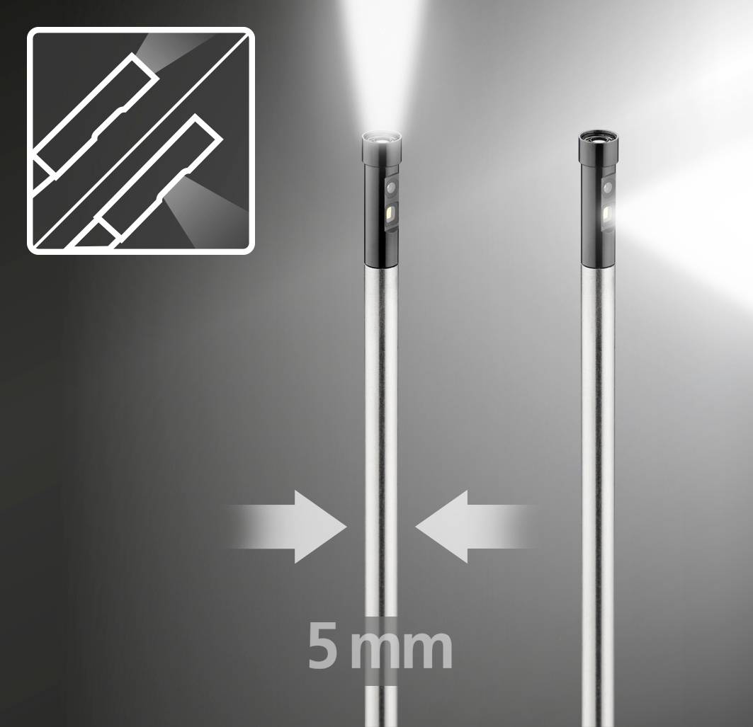 Zwei dünne, leuchtende Metallstäbe nebeneinander, getrennt durch einen Abstand von 5 mm, mit einem Detailzoom oben links.