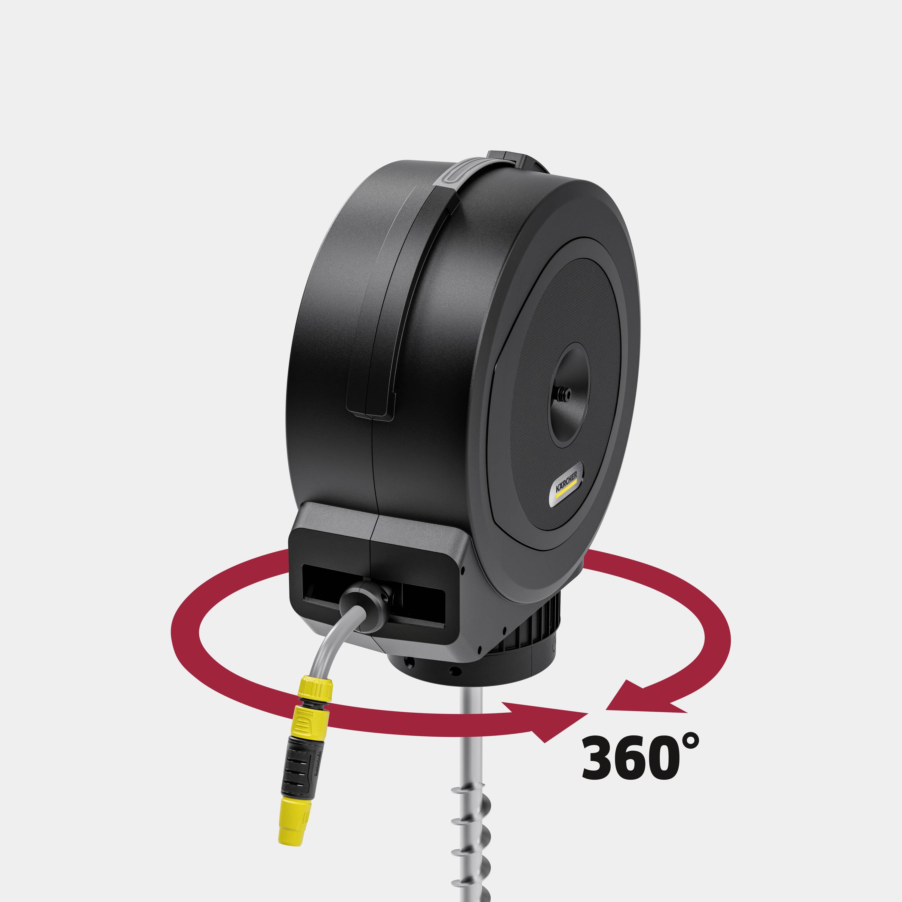 Automatische Kabeltrommel auf grauem Hintergrund, montiert auf Stange, mit 360-Grad-Schwenkmechanismus und angeschlossenem gelbem Stecker.