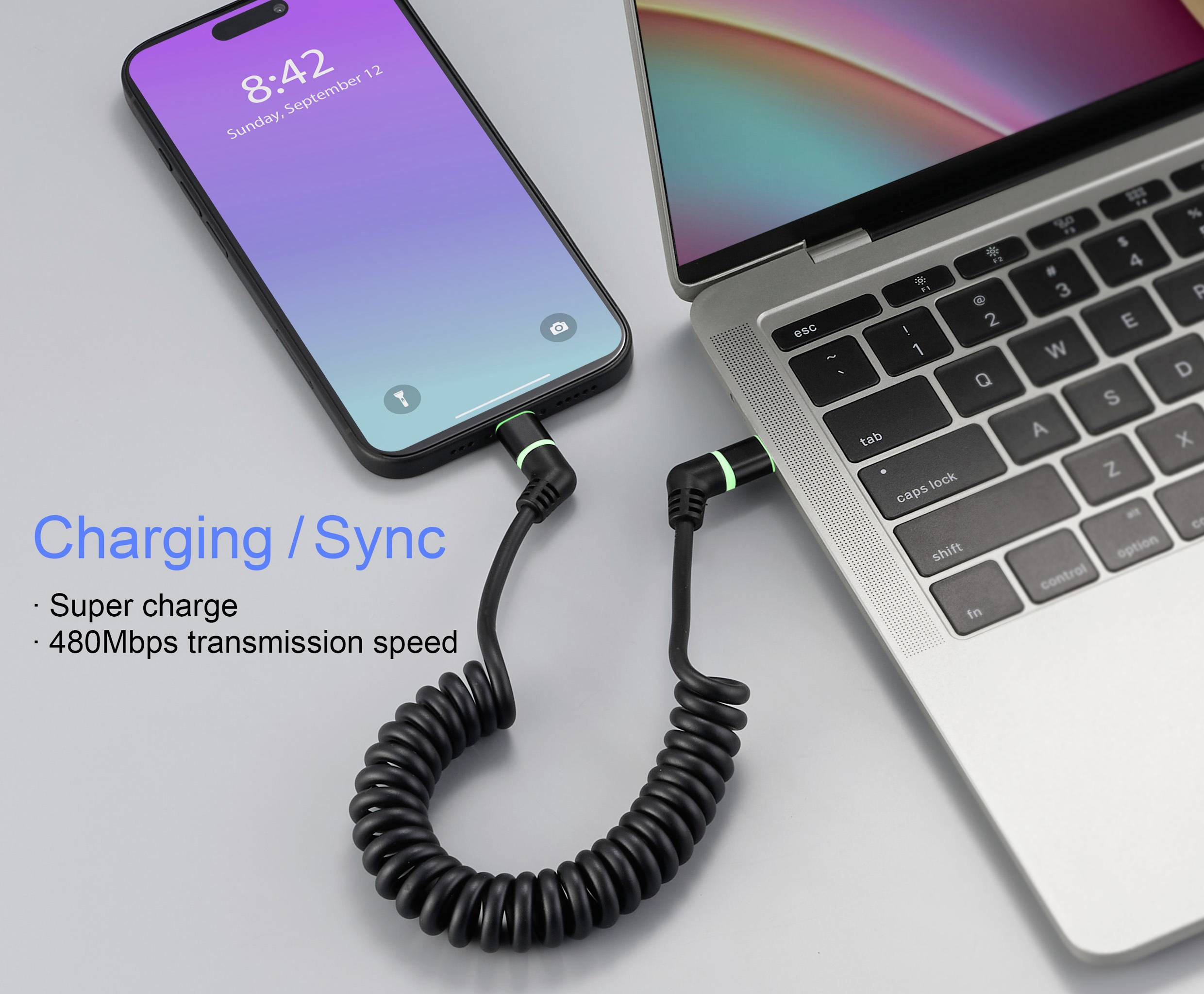 Handy verbunden mit einem Laptop durch ein Spiralkabel. Auf dem Handybildschirm steht '8:42, Sonntag, 12. September'. Text: 'Charging/Sync'. Superladen, 480Mbps Übertragungsgeschwindigkeit.