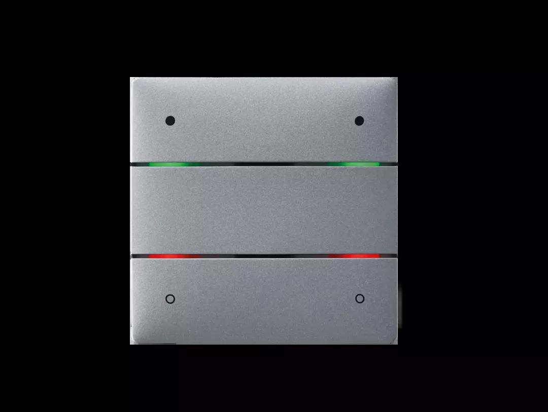 Metallischer Schalter mit zwei horizontalen Streifen. Oben leuchtet ein grünes Licht, unten ein rotes Licht. Hintergrund schwarz.