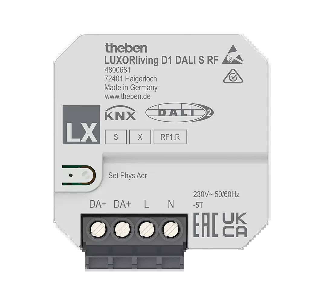 Ein weißes, sechseckiges Gerät mit dem Text 'LUXORliving D1 DALI S RF' und technischen Informationen, inklusive Anschlüssen an der Unterseite.