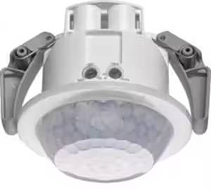 Ein runder Deckenbewegungsmelder mit zwei seitlichen Halterungen zur Befestigung in einem Deckenpanel.