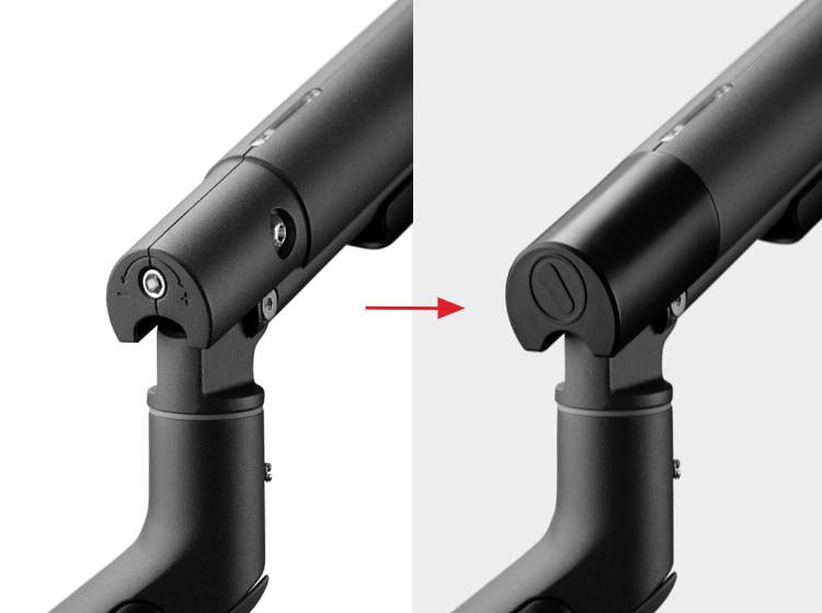 Zwei schwarze Gelenkarme im Vergleich: links mit Schrauben sichtbar, rechts mit abdeckendem Element. Roter Pfeil zeigt Veränderung.
