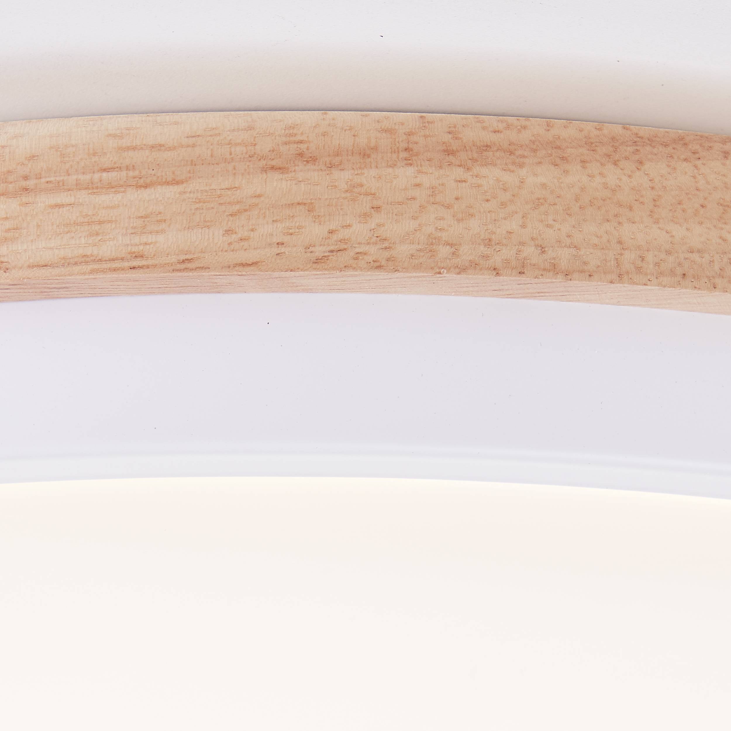 Runde LED-Deckenleuchte mit Holzdekor und warmweißem Licht, geeignet für moderne Wohnräume.