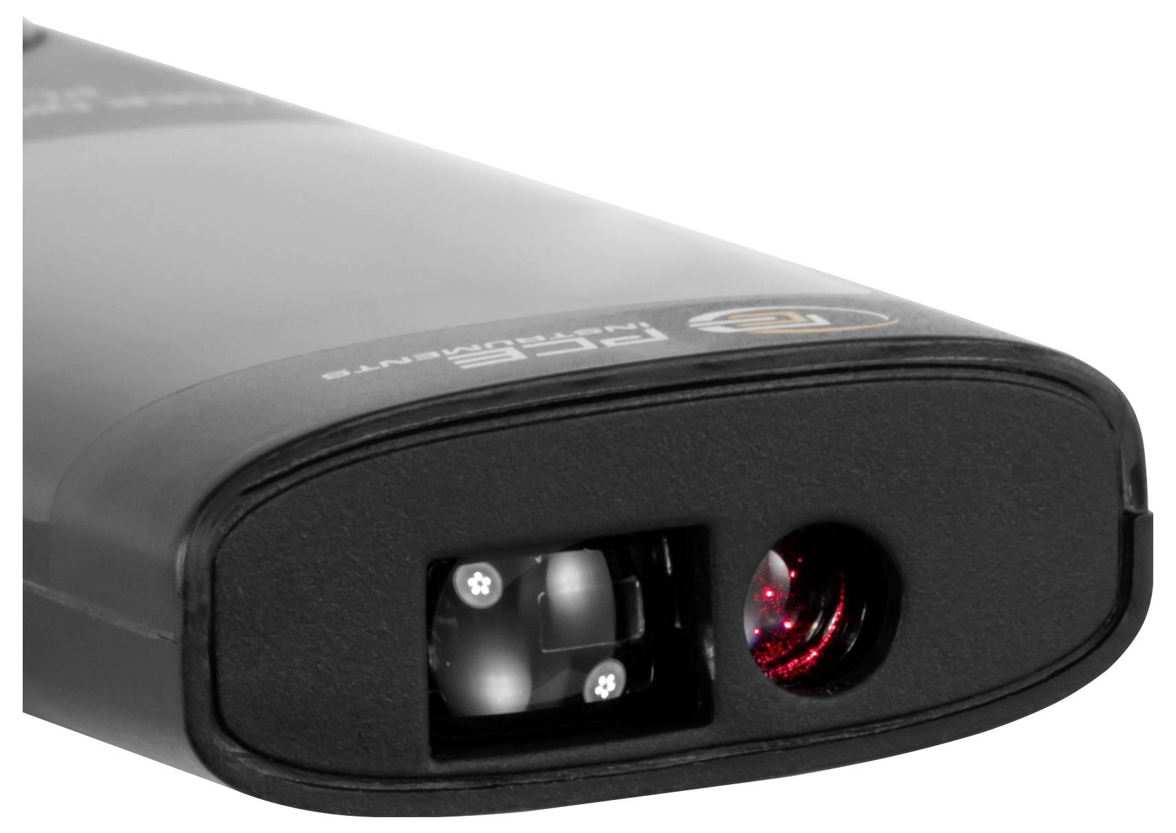 Close-up of a black handheld device’s front end with a lens and red-lit sensor/indicator window.